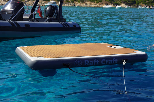 Raft Craft RC102 large floating dock on open water, teak-effect deck filling the frame