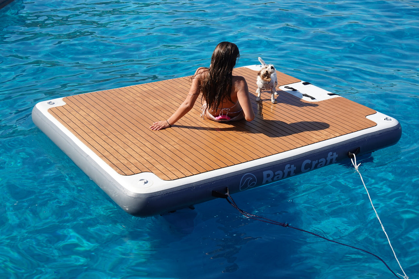 RC102 floating dock in use, a person reclining on the deck