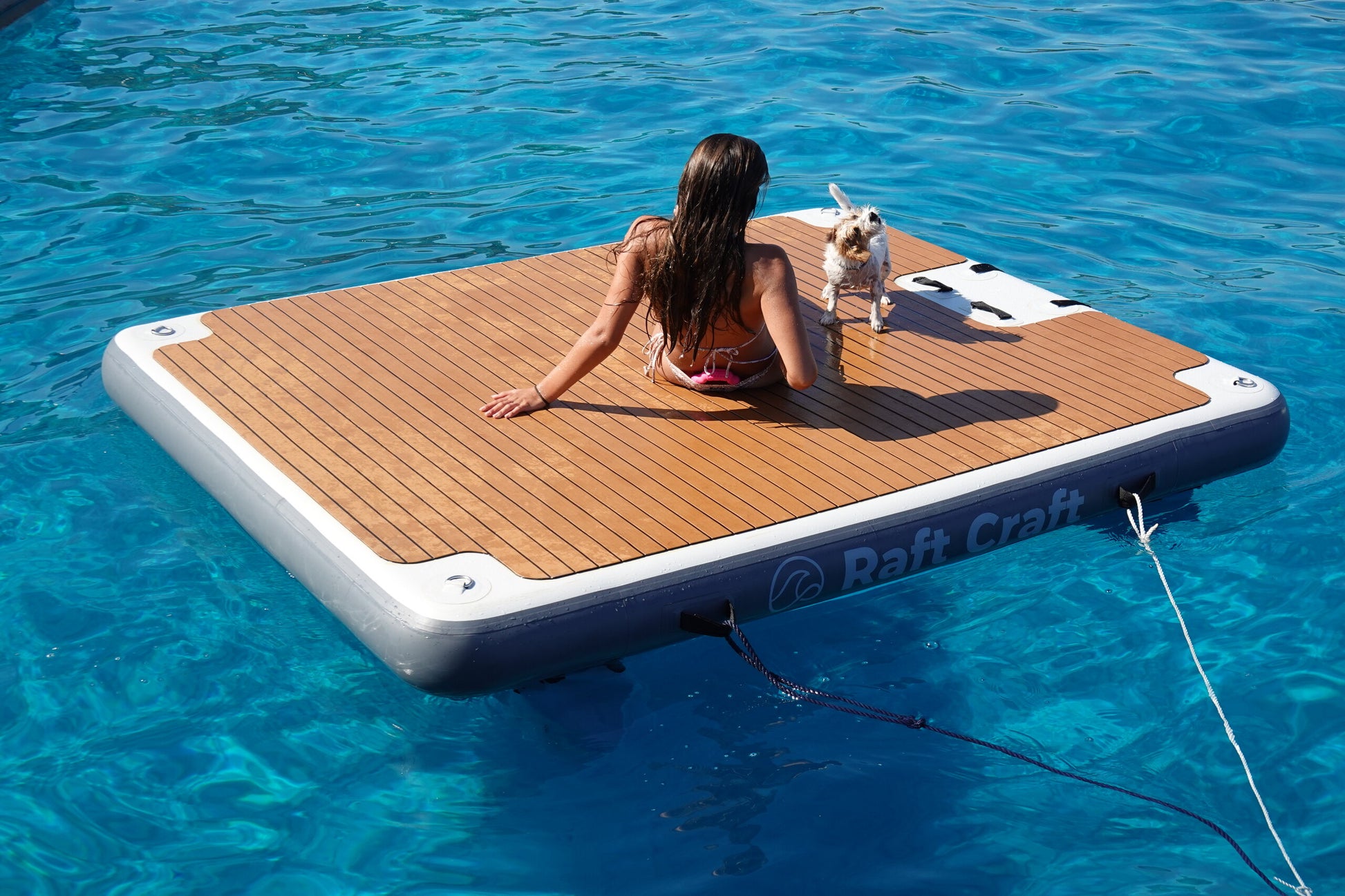 RC102 floating dock in use, a person reclining on the deck