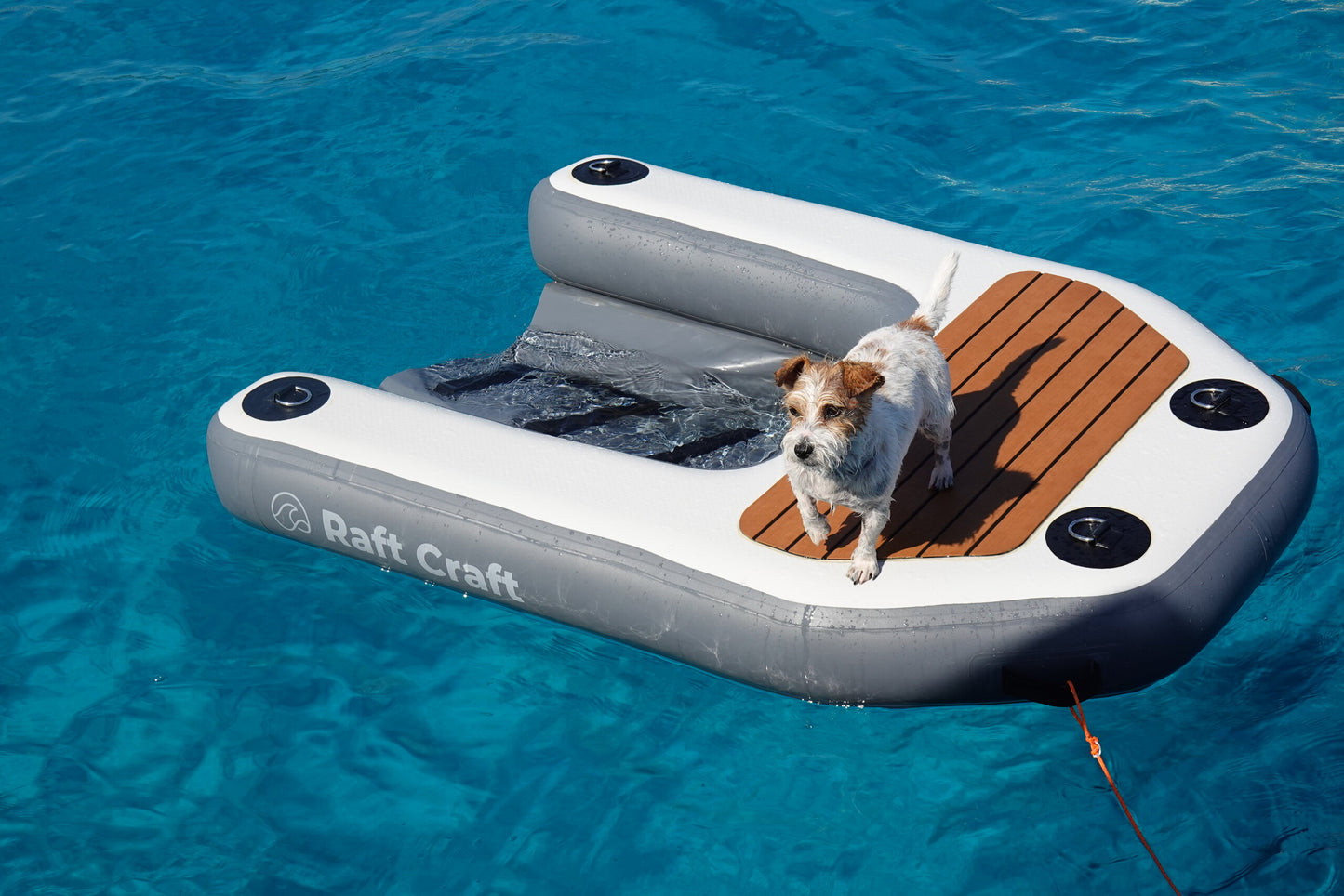 RCD102 dog ramp tethered on calm water in an anchorage